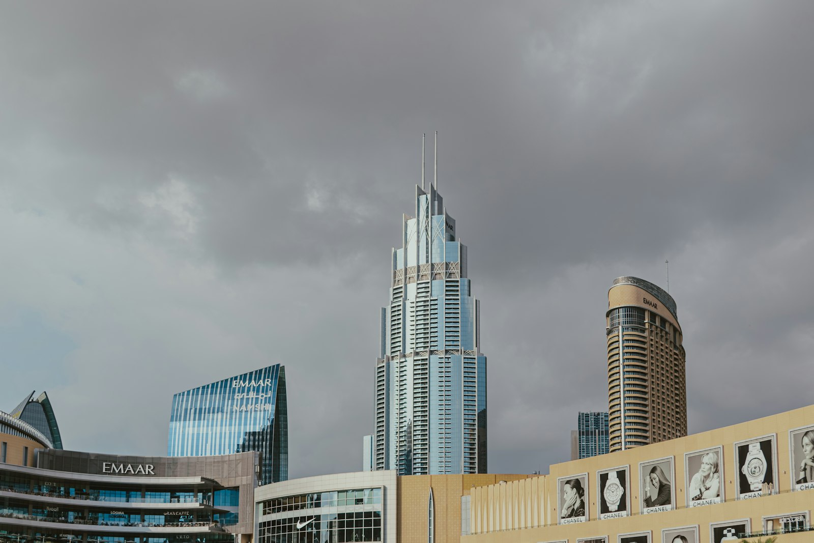 Office towers seen from below against a heavy sky