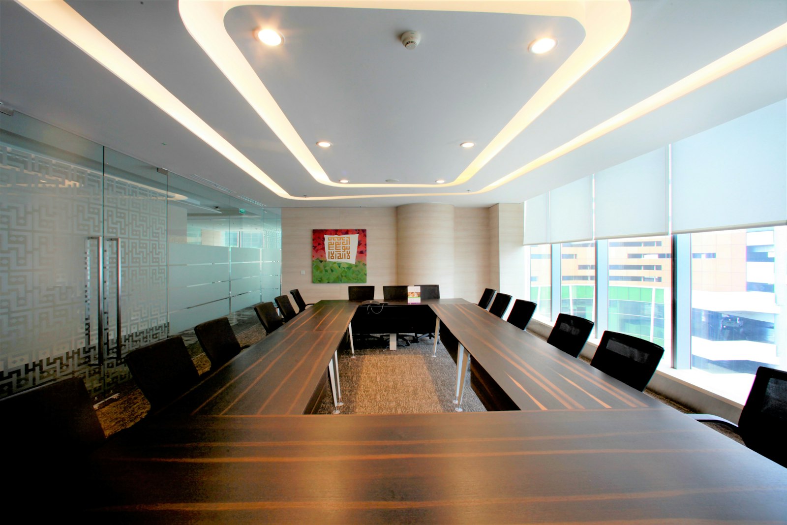 Meeting room with floor-to-ceiling windows looking out over the city